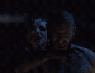 A Man And A Woman With Blue Painted Faces GIF