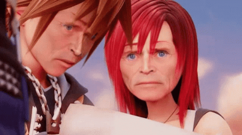 A Man And A Woman With Red Hair Are Standing Next To Each Other In A Video Game . GIF