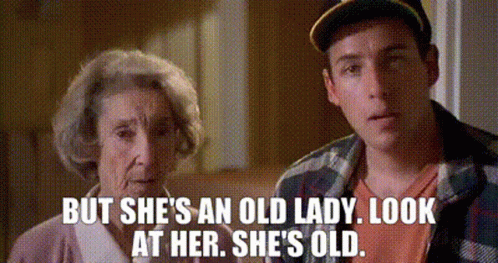 A Man And An Elderly Woman Are Standing Next To Each Other And The Woman Says But She 'S An Old Lady Look At Her GIF