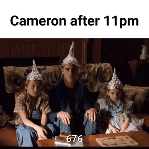 A Man And Two Children Wearing Aluminum Foil Hats Are Sitting On A Couch With The Caption Cameron After 11 Pm GIF
