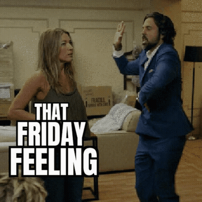 A Man And Woman Are Dancing In A Living Room . GIF