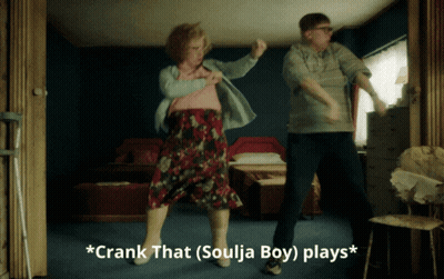 A Man And Woman Are Dancing In A Room With The Words * Crank That Soulja Boy Plays * Below Them GIF