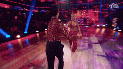 A Man And Woman Are Dancing On A Stage With Dancing Brasil Written On The Bottom GIF