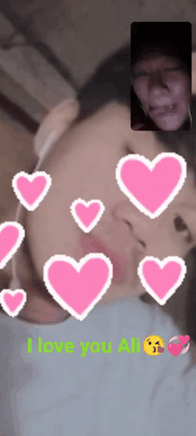 A Man And Woman Are Having A Video Call And The Words I Love You Ali Are On The Screen GIF