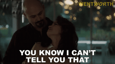 A Man And Woman Are Hugging And The Man Is Saying " You Know I Can 'T Tell You That " GIF