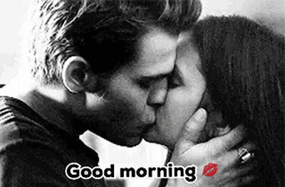 A Man And Woman Are Kissing In A Black And White Photo With The Words `` Good Morning '' . GIF