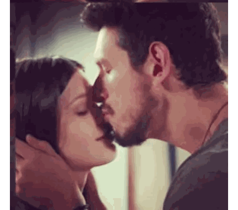 A Man And Woman Are Kissing In Front Of A Mirror Sticker