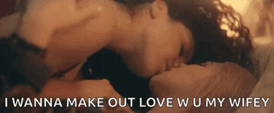 A Man And Woman Are Kissing On A Bed With The Words `` I Wanna Make Out Love W U My Wifey '' GIF