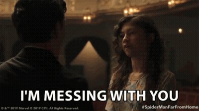 A Man And Woman Are Looking At Each Other And The Woman Is Saying I 'M Messing With You GIF