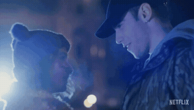 A Man And Woman Are Looking Into Each Other 'S Eyes . GIF