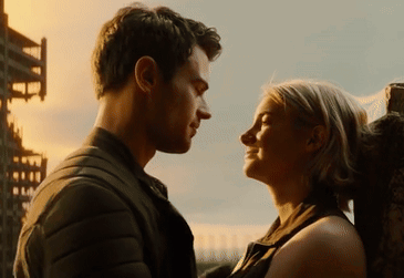 A Man And Woman Are Looking Into Each Others Eyes GIF