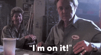 A Man And Woman Are Sitting At A Table And The Man Is Saying I 'M On It GIF