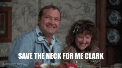 A Man And Woman Are Sitting At A Table With The Words Save The Neck For Me Clark Written On The Screen . GIF