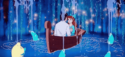 A Man And Woman Are Sitting In A Boat In The Water Surrounded By Sharks . GIF