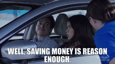 A Man And Woman Are Sitting In A Car Talking To Each Other . GIF