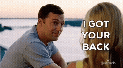 A Man And Woman Are Sitting Next To Each Other And The Man Is Saying I Got Your Back GIF