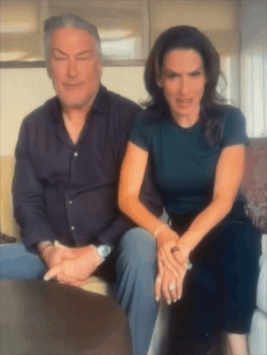 Man And Woman Sitting Next To Each Other GIF