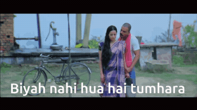 A Man And Woman Are Standing In Front Of A Bicycle With The Words Biyah Nahi Hua Hai Tumhara Written On The Bottom GIF