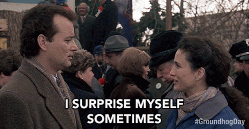 A Man And Woman Are Standing In Front Of A Crowd And The Man Says I Surprise Myself Sometimes GIF
