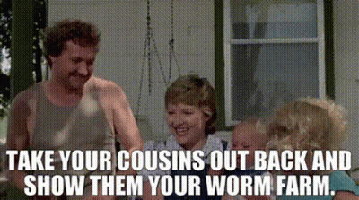 A Man And Woman Are Standing In Front Of A House With The Words Take Your Cousins Out Back And GIF