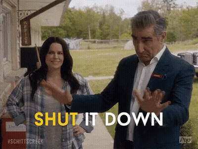 A Man And Woman Are Standing Next To Each Other And The Man Is Saying Shut It Down . GIF