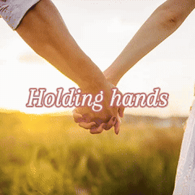 A Man And Woman Holding Hands With The Words Holding Hands Below Them GIF