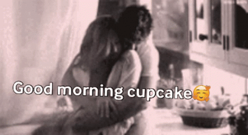 A Man And Woman Hugging With The Words " Good Morning Cupcake " On The Bottom GIF