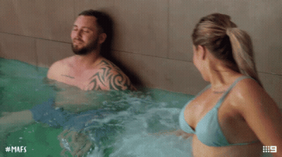 A Man And Woman In A Hot Tub With The Hashtag Mafs On The Bottom GIF
