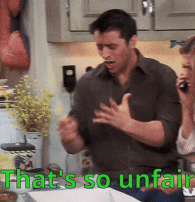 A Man And Woman In A Kitchen With The Words That 'S So Unfair In Green GIF