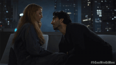 A Man And Woman Kissing On A Couch With #It Ends With Us Movie Written Below Them GIF
