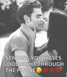 A Man And Woman Kissing With The Words Sending You Kisses Goodnight Through The Phone Below Them GIF