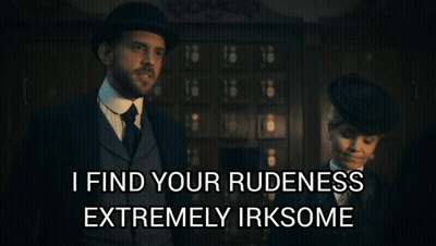 A Man And Woman Standing Next To Each Other With A Caption That Says I Find Your Rudeness Extremely Irksome GIF