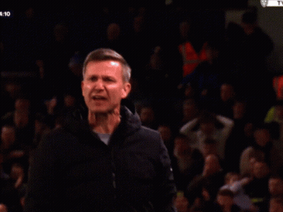 A Man Applauds In Front Of A Crowd With The Time 4:11 GIF