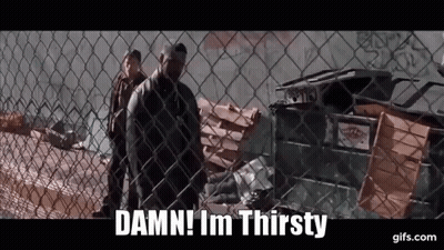 A Man Behind A Chain Link Fence Says " Damn ! Im Thirsty " GIF