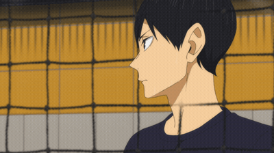 A Man Behind A Volleyball Net Looks At Something GIF