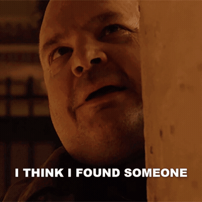 A Man Behind A Wall With The Words I Think I Found Someone Written Below Him GIF
