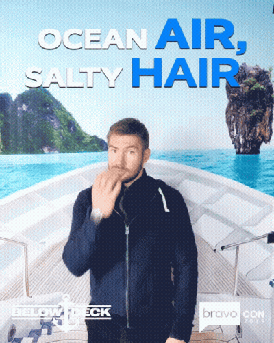 A Man Blowing A Kiss In Front Of An Ocean Air Salty Hair Poster GIF