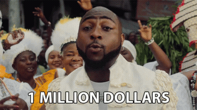 A Man Blowing A Kiss With The Words 1 Million Dollars Above Him GIF