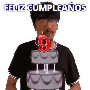 A Man Blowing Out A Candle On A Cake With The Number 9 On It Sticker