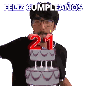 A Man Blowing Out Candles On A Birthday Cake With The Number 21 On It Sticker