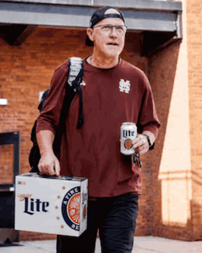 A Man Carrying A Box Of Lite Beer And A Can Of Beer GIF
