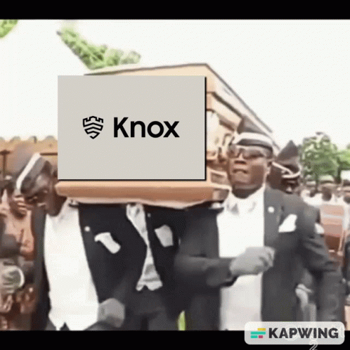 A Man Carrying A Coffin With Knox On It GIF