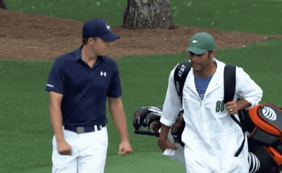 A Man Carrying A Golf Bag Has The Number 80 On His Shirt GIF