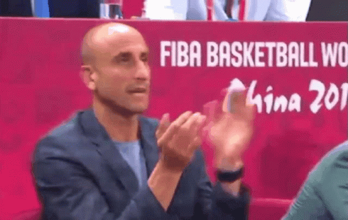 A Man Clapping In Front Of A Fiba Basketball World Sign GIF