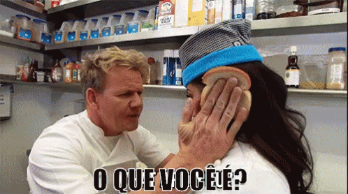 A Man Covering A Woman 'S Ear With A Piece Of Bread And The Words O Que Você ? Below Him GIF