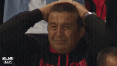 A Man Covering His Ears While Wearing A Watch And A Shirt That Says " Futbol Karim " GIF