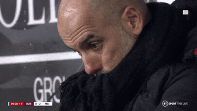 A Man Covering His Face With A Scarf In Front Of A Bt Sport Hd Live Sign GIF