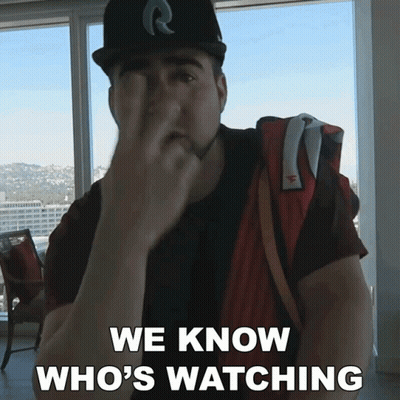 A Man Covering His Face With His Hand And The Words We Know Who 'S Watching Below Him GIF