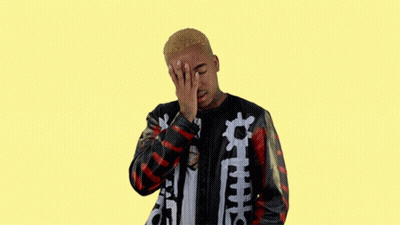 A Man Covering His Face With His Hand And Wearing A Jacket That Says ' Supreme ' On It GIF