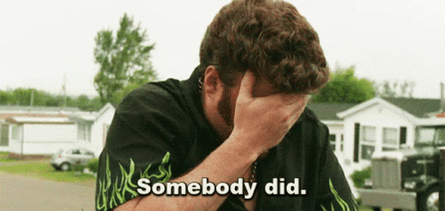 A Man Covering His Face With His Hand With The Words Somebody Did Written Below Him GIF